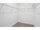 Walk-in closet with neutral carpet, maximizing storage with wire shelving at 1904 Archer Dr, Minneola, FL 34715