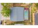 Overhead shot of the home featuring a screened pool, fenced yard, mature trees, and neighborhood views at 1993 Excalibur Dr, Orlando, FL 32822