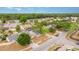 Aerial of neighborhood homes with mature trees, lush landscaping, and community streets at 1993 Excalibur Dr, Orlando, FL 32822