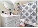 Bathroom featuring a stylish vanity, modern fixtures, and patterned shower curtain at 1993 Excalibur Dr, Orlando, FL 32822