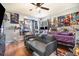 Bedroom with wood floors, ceiling fan, and various entertainment posters at 1993 Excalibur Dr, Orlando, FL 32822