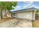 Attractive home with an attached garage and a neat front lawn, enhanced by a mature tree at 1993 Excalibur Dr, Orlando, FL 32822