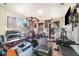 Well-equipped home gym with weights, machines, and natural light at 1993 Excalibur Dr, Orlando, FL 32822