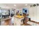 Open kitchen with a view to a dining room and featuring an island with butcher block top at 1993 Excalibur Dr, Orlando, FL 32822