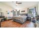 Comfortable main bedroom with neutral walls, wood floors, and large windows at 1993 Excalibur Dr, Orlando, FL 32822