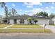 Charming single-story home featuring a well-maintained lawn, two-car garage, and inviting curb appeal at 2028 Sussex Rd, Winter Park, FL 32792