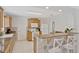 Updated kitchen with stainless steel appliances, granite counters, and breakfast bar seating at 2028 Sussex Rd, Winter Park, FL 32792