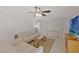 Bright living room with a ceiling fan, neutral color palette, and tile flooring offers a calm and welcoming space at 2028 Sussex Rd, Winter Park, FL 32792