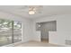 Cozy living room featuring ceramic floors, large windows, and a ceiling fan at 2028 Sussex Rd, Winter Park, FL 32792