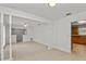 Spacious open-concept living room with ceramic floors, ceiling fan, and views to the kitchen at 2028 Sussex Rd, Winter Park, FL 32792