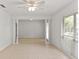 Bright living room with large windows and tile flooring throughout at 2028 Sussex Rd, Winter Park, FL 32792