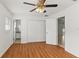 Bedroom with ceiling fan, wood flooring, en suite bathroom and large closet at 2028 Sussex Rd, Winter Park, FL 32792