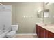 Bathroom featuring a shower and bath combo, a toilet, and a sink at 2260 The Oaks Blvd, Kissimmee, FL 34746