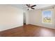 Bright bedroom with hardwood floors, a ceiling fan, and walk-in closet at 2260 The Oaks Blvd, Kissimmee, FL 34746