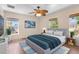 Bright primary bedroom featuring hard wood floors, recessed lighting, and a ceiling fan at 2260 The Oaks Blvd, Kissimmee, FL 34746