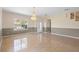 A spacious dining room featuring neutral decor and decorative lighting at 2260 The Oaks Blvd, Kissimmee, FL 34746