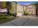 Charming two-story home with well-maintained landscaping and a two car garage at 2260 The Oaks Blvd, Kissimmee, FL 34746