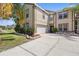 Charming two-story home featuring a two-car garage and well-maintained landscaping at 2260 The Oaks Blvd, Kissimmee, FL 34746
