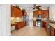 Traditional kitchen featuring stainless steel appliances, granite countertops, and tile backsplash at 2260 The Oaks Blvd, Kissimmee, FL 34746