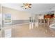 Bright and spacious living room features tile floors, neutral paint, with easy access to the kitchen and backyard at 2260 The Oaks Blvd, Kissimmee, FL 34746