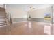 Large living room with tiled floor, neutral colors and a staircase at 2260 The Oaks Blvd, Kissimmee, FL 34746