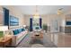 Beautiful living room with elegant decor, tile flooring, and lots of natural light at 2260 The Oaks Blvd, Kissimmee, FL 34746