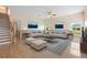 Cozy living room showcasing elegant furnishings, wainscoting, and a staircase at 2260 The Oaks Blvd, Kissimmee, FL 34746