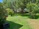 Beautiful backyard with garden and lush landscaping, perfect for outdoor activities and relaxation at 24125 Peekskill St, Leesburg, FL 34748