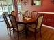 Charming dining area featuring a round table, natural light, and cozy ambiance at 24125 Peekskill St, Leesburg, FL 34748