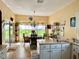 Eat-in kitchen with an abundance of natural light and a view of the yard at 24125 Peekskill St, Leesburg, FL 34748