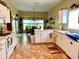 Spacious kitchen with white cabinets, ample counter space, and modern appliances at 24125 Peekskill St, Leesburg, FL 34748