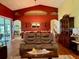 Comfortable living room with high ceilings, hardwood floors, and stylish furniture at 24125 Peekskill St, Leesburg, FL 34748
