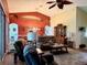 Cozy living room featuring ample seating, natural light, and tasteful decor at 24125 Peekskill St, Leesburg, FL 34748
