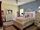Serene bedroom with a comfortable bed, neutral colors, and plenty of natural light at 24125 Peekskill St, Leesburg, FL 34748