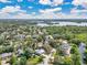 Breathtaking aerial view with lush landscaping, gorgeous homes, and a stunning lake at 2525 Venetian Way, Winter Park, FL 32789