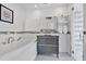 Modern bathroom featuring a soaking tub, sleek vanity, and mosaic tile accents at 2525 Venetian Way, Winter Park, FL 32789