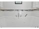 Clean, bright bathtub with integrated jets, perfect for a relaxing bath experience at 2525 Venetian Way, Winter Park, FL 32789
