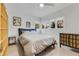 Cozy bedroom with natural light, simple furnishings, and garden views at 2525 Venetian Way, Winter Park, FL 32789