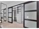 Spacious walk-in closet with custom shelving and storage solutions, and sliding door entrance at 2525 Venetian Way, Winter Park, FL 32789