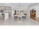 Spacious dining room featuring an elegant table, modern chandelier, and stylish decor at 2525 Venetian Way, Winter Park, FL 32789