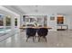 Dining area with modern table and view of kitchen and swimming pool at 2525 Venetian Way, Winter Park, FL 32789