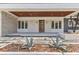 Front porch with striking front door and stone accents and landscape at 2525 Venetian Way, Winter Park, FL 32789