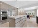 Contemporary kitchen featuring stainless steel appliances, a large island, and an open layout at 2525 Venetian Way, Winter Park, FL 32789