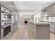 Contemporary kitchen featuring stainless steel appliances and seamless design at 2525 Venetian Way, Winter Park, FL 32789