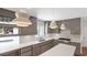 Stylish kitchen with stainless steel appliances, bright lighting, and a modern design at 2525 Venetian Way, Winter Park, FL 32789