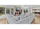 Open living area showcasing a large sectional couch, fireplace, and access to the outdoors at 2525 Venetian Way, Winter Park, FL 32789