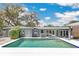 Back of house with pool and patio area at 2525 Venetian Way, Winter Park, FL 32789