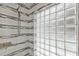 Modern shower with unique glass block wall and sleek fixtures at 2525 Venetian Way, Winter Park, FL 32789