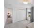 This bedroom features a built in closet, large window, and a view into the other part of the house at 2680 Nottel Dr, St Cloud, FL 34772