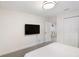 This bright bedroom is minimalist and features a TV, walk-in closet, and access to a sitting area at 2680 Nottel Dr, St Cloud, FL 34772